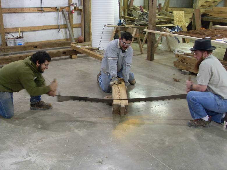 Camp Barn Restoration / Cannon Salvage workers cleaning, applying borate, and waxing the frame.